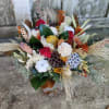 Enjoy a dried arrangement perfect for you holiday table! Fragrant dried flowers