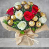 A modern flower arrangement filled with roses and chocolates.
Picked fresh from farms