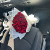 A dreamy bouquet wrapped in beautiful white floral wrap. Bright red ecuadorian