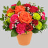 A dreamy dose of happiness, this beautiful orange and pink arrangement looks