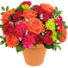 A dreamy dose of happiness, this beautiful orange and pink arrangement looks