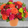 A dreamy dose of happiness, this beautiful orange and pink arrangement looks