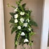 A beautifully unique spray of mixed fresh florals. White spider mums top