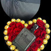 A modern flower arrangement in a heart box filled with roses &amp;