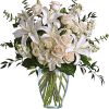 A dreamy bouquet of white sympathy flowers is a comforting reminder of