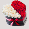 A modern flower arrangement in a heart box filled with roses.

DETAILS
This heart
