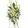 An elegant expression of sympathy, this wondrous white and green spray conveys