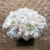 A gorgeous arrangement with light colors sure to put a sparkle in