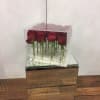 A dozen beautiful fresh red roses (or color of your choice) inside