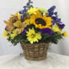A beautiful wicker basket full of fresh Autumn themed blooms. Makes for