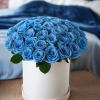 Stunning beauty of blue sky roses in a chic hatbox. This vibrant
