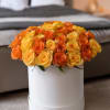 Enjoy your moments with our luxurious hatbox arrangement, featuring vibrant yellow and