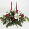 Assorted Christmas greens with red roses , white Lillie&rsquo;s , white wax