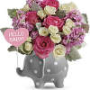 Celebrate a sweet girl&#039;s arrival with this precious ceramic elephant, bursting with