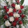Spray with red roses, white hydrangeas, and white Gladiolus.