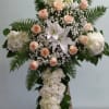 Cross white hydrangeas, white lilies, and peach roses.