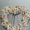 Open heart with light pink roses, white gerbera daisies, white spray roses