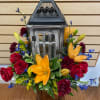 Lantern with mixed flowers (red roses, orange lilies, yellow solidago, and blue