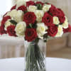 Our bouquet of red and white roses in a vase is an