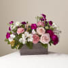Designed with the freshest blooms of peach roses, purple carnations, pink carnations