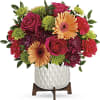 Talk about a bright idea! This cheerful bouquet of peach gerberas brings