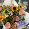 Stunning bouquet full of Sunflowers, Spray Roses, and other mixed flowers