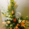 Seasonal flowers with stone added. STONES AND FLOWERS MAY VARY DUE TO