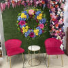This colorful and bright wreath spray is representative of a life lived