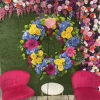 This colorful and bright wreath spray is representative of a life lived