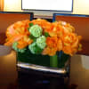 Perfect for a dining or conference table, this oblong bouquet of roses