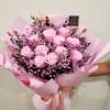 12 light pink preserved roses with pink preserved baby&#039;s breath and fillers