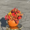 Real Pumpkin unique arrangement, includes , orchids, roses, sunflower, chrysanthemum, button Pom