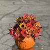 Real Pumpkin unique arrangement, includes , orchids, roses, sunflower, chrysanthemum, button Pom