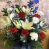 RED AND WHITE CARNATIONS, WHITE LILIES AND BLUE DELPHINIUM WITH SILVER RUSCUS