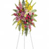 A splash of color standing spray made with Glads, Stargazer Lilies, Spray