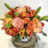 Vibrant and festive blooms in fall tones and textures.  Florals may