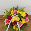 This arrangement has a classic beauty of red and yellow roses with