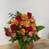 Harvest Glow Arrangement brings a romantic and radiant touch to any space.