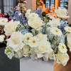 A mixed of Hydrangea, gerbera, roses, carnation, stock, and delphinium in blue