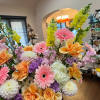 Soft bouquet in light pink, peach, yellow, lavender using roses, dahlia, snap