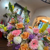 Soft bouquet in light pink, peach, yellow, lavender using roses, dahlia, snap
