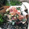Blush and peach toned with accent of fuschia pink bouquet
