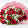 12 red roses with baby&#039;s breath wrapped in paper/net