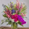 A tall and majestic display of pastel favorites including hydrangea, pink larkspur