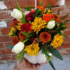 AVAILABLE DURING FALL 
Mixed fall flowers with white tulips