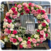 This sympathy arrangement is in the form of a wreath and it&#039;s