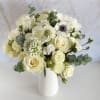 The Whispering Grace Arrangement is a sophisticated composition of pure elegance and