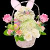 This Easter Bunny arrangement with colorful decorative eggs. Easter Bunny is wearing