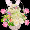 This Easter Bunny arrangement with colorful decorative eggs. Easter Bunny is wearing