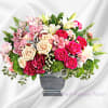This grand arrangement features dark pink hydrangea, pink cymbidium orchid blossoms, cr&egrave;me
